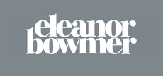 The logo for raspberry blossom is white on a grey background.