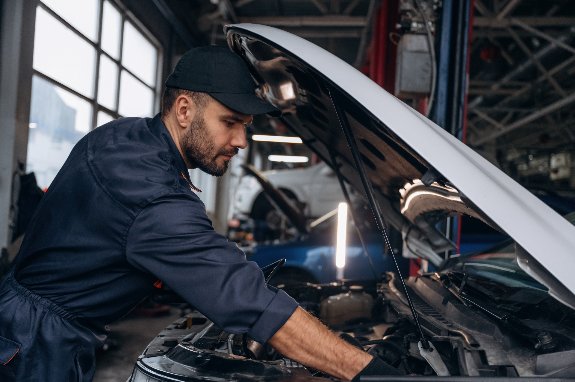 Car mechanic working on a Volkswagen timing chain.
