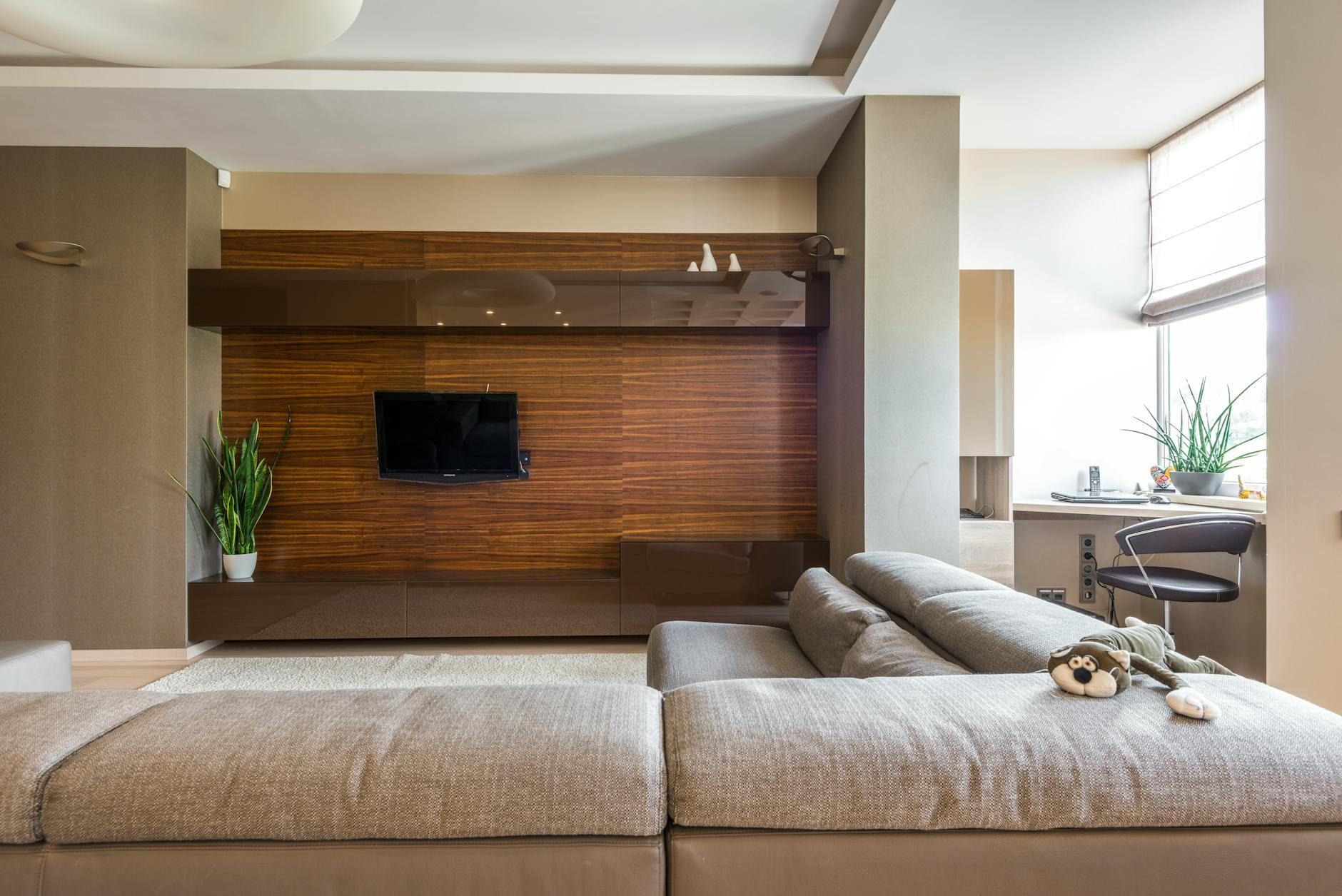 A spacious living room invested with advanced home automation in luxury apartments.