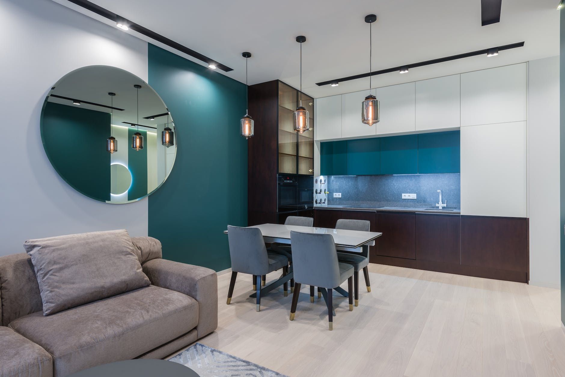 The cost and fees of a white-walled 2-bedroom apartment in Buffalo combined with teal colors.