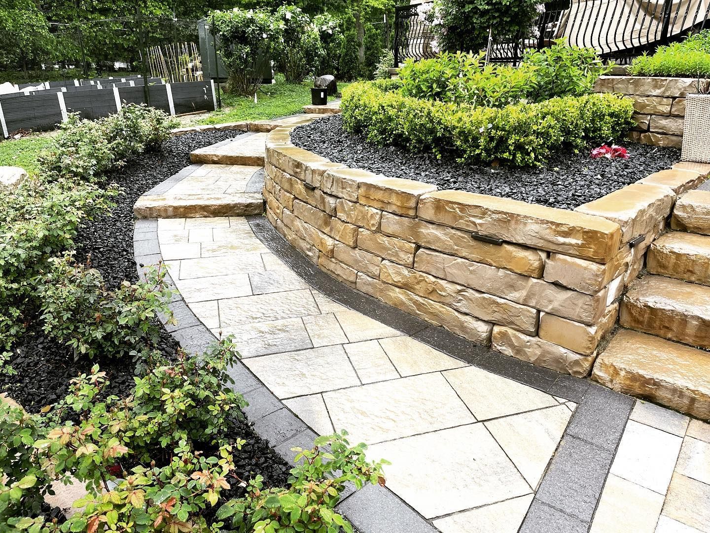 there is a fire pit in the middle of the patio .