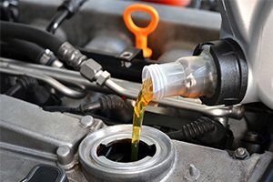 Car Repairs — Refueling and Pouring Oil in West Allis, WI