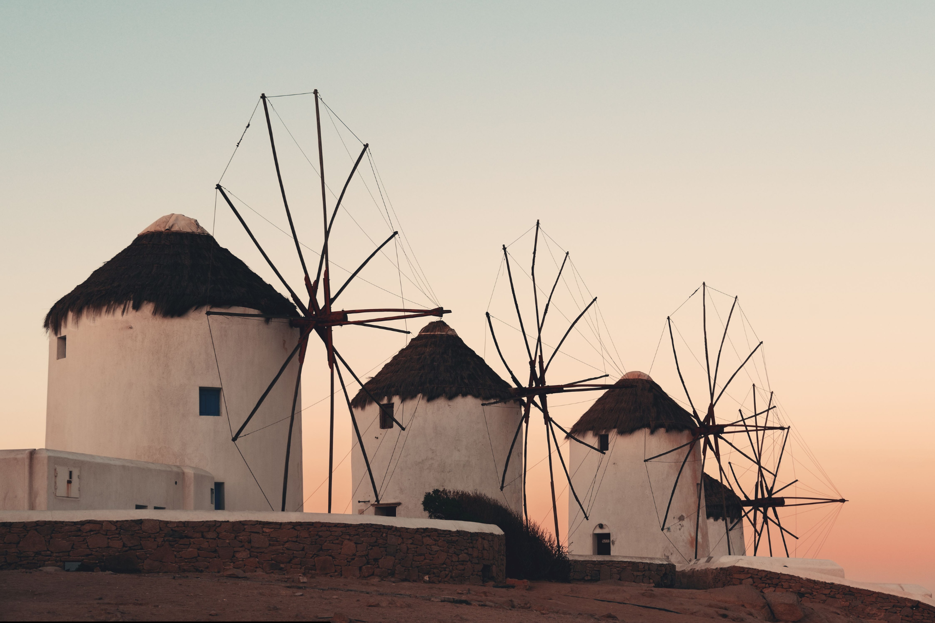 Mykonos windmills at sunset. Popular landmark near yacht charter departure points in Mykonos.