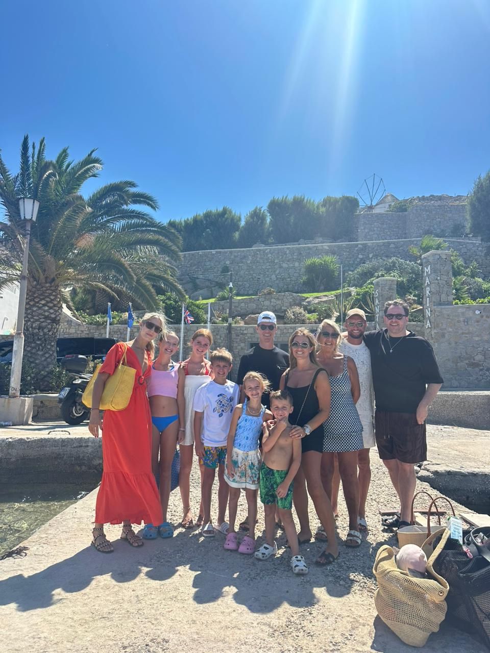 Host and guests meeting in Ornos, Mykonos, before departure. Curated Mykonos yacht cruise experience