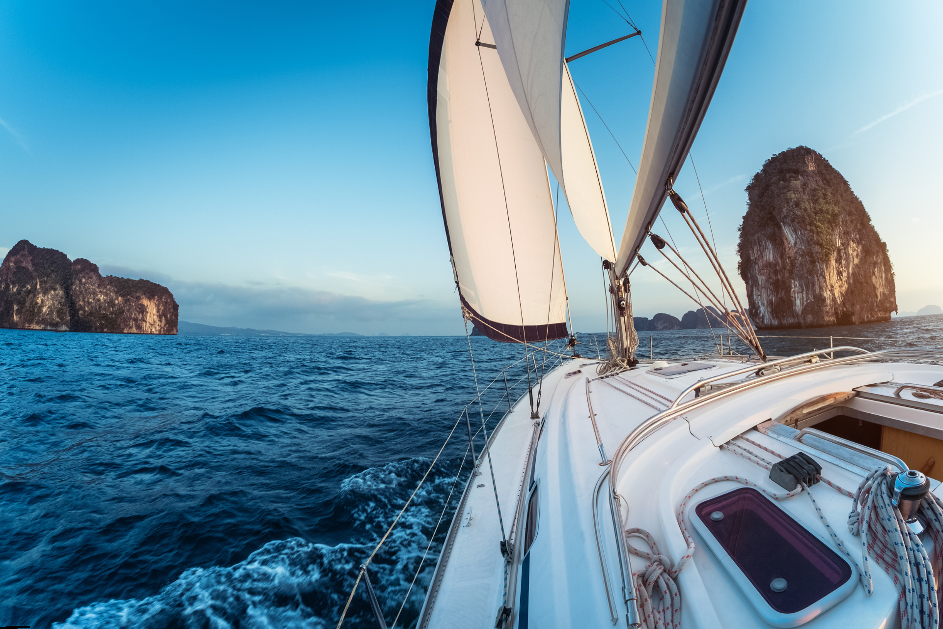 Sailing yacht navigating open sea conditions in the Cyclades, illustrating how wind and sea shape yacht itineraries.
