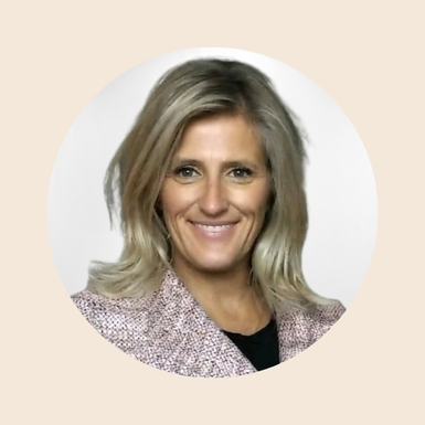 Portrait of Melony smiling, wearing a pink blazer, in a round frame against a beige background.