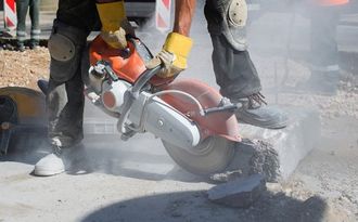 a technician cutting concrete using cutters