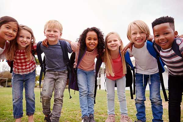 Portrait of excited elementary school pupils