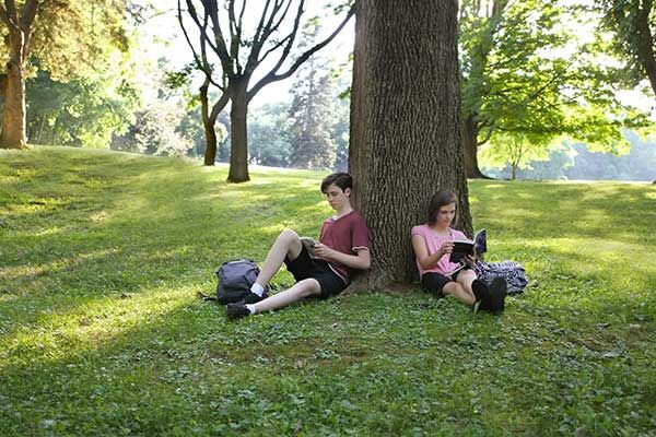 Teens under tree