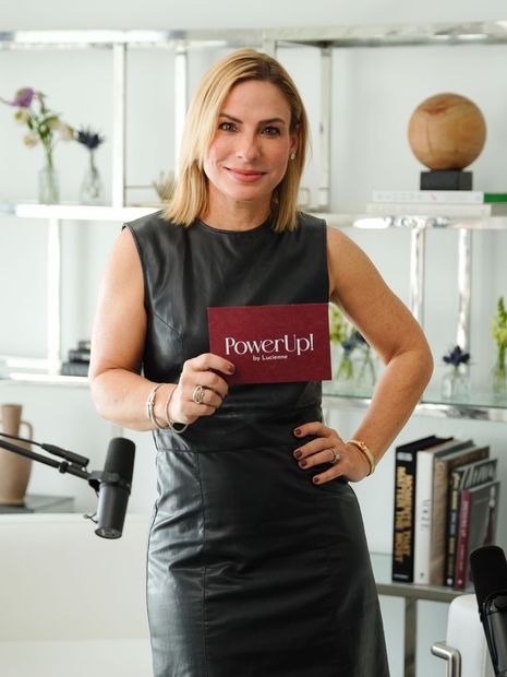 Lucienne in black dress holding a