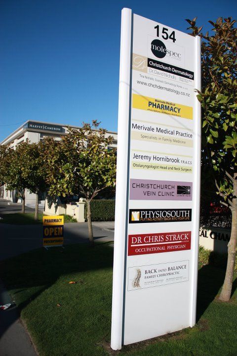 A tall white sign with the number 154 on it