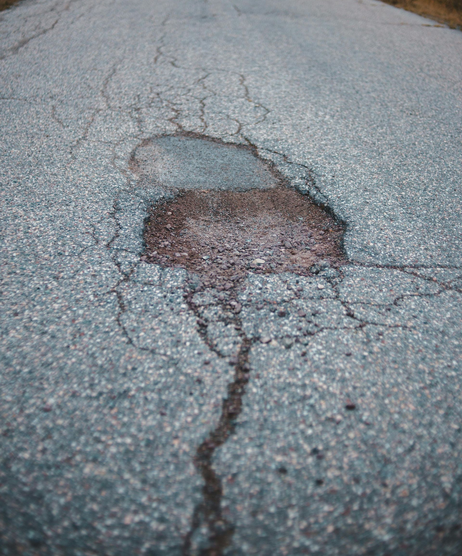A group of construction workers are working on a concrete walkway.