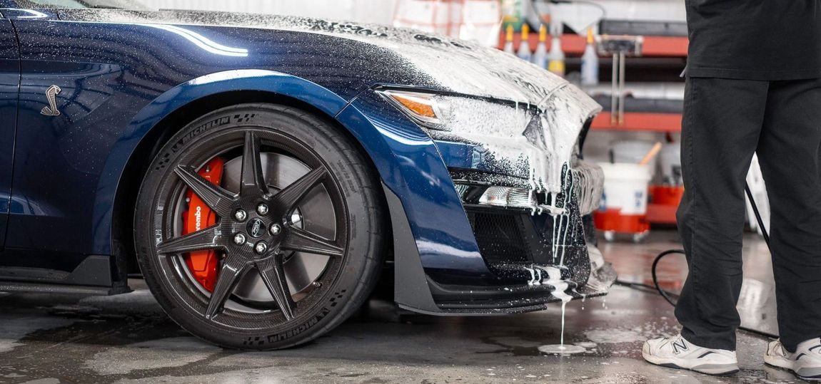 a man washes a car