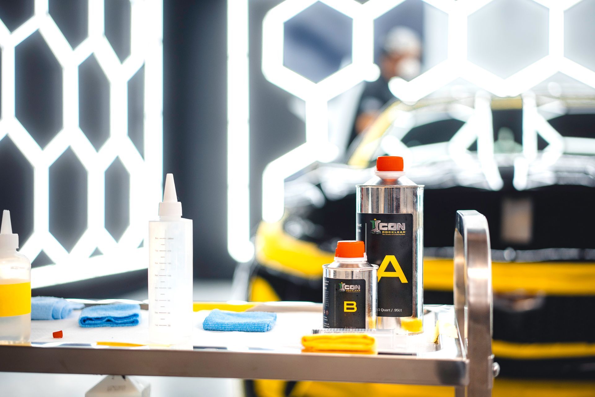 A red corvette is parked in a parking lot