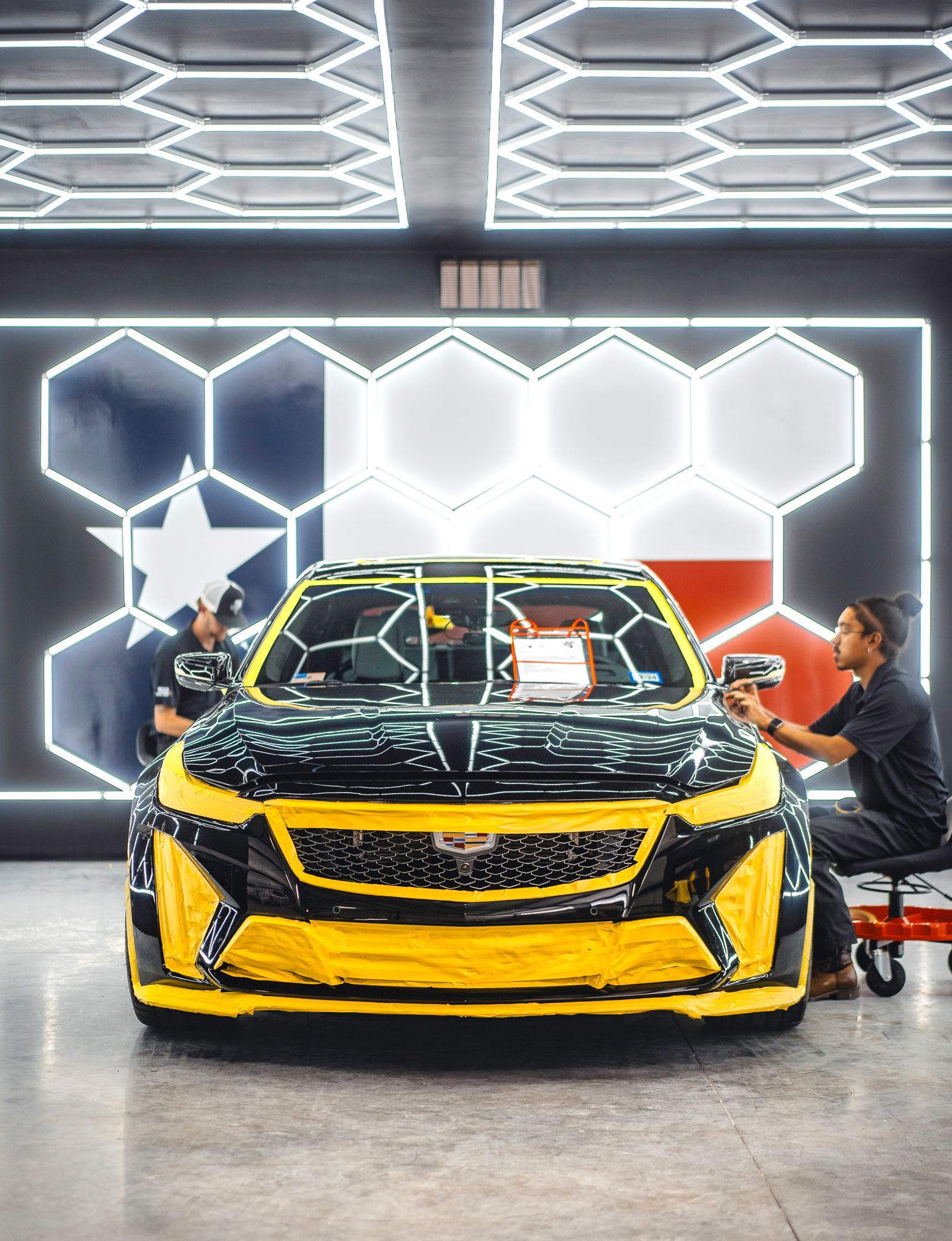 A toyota tundra is parked in front of a garage.