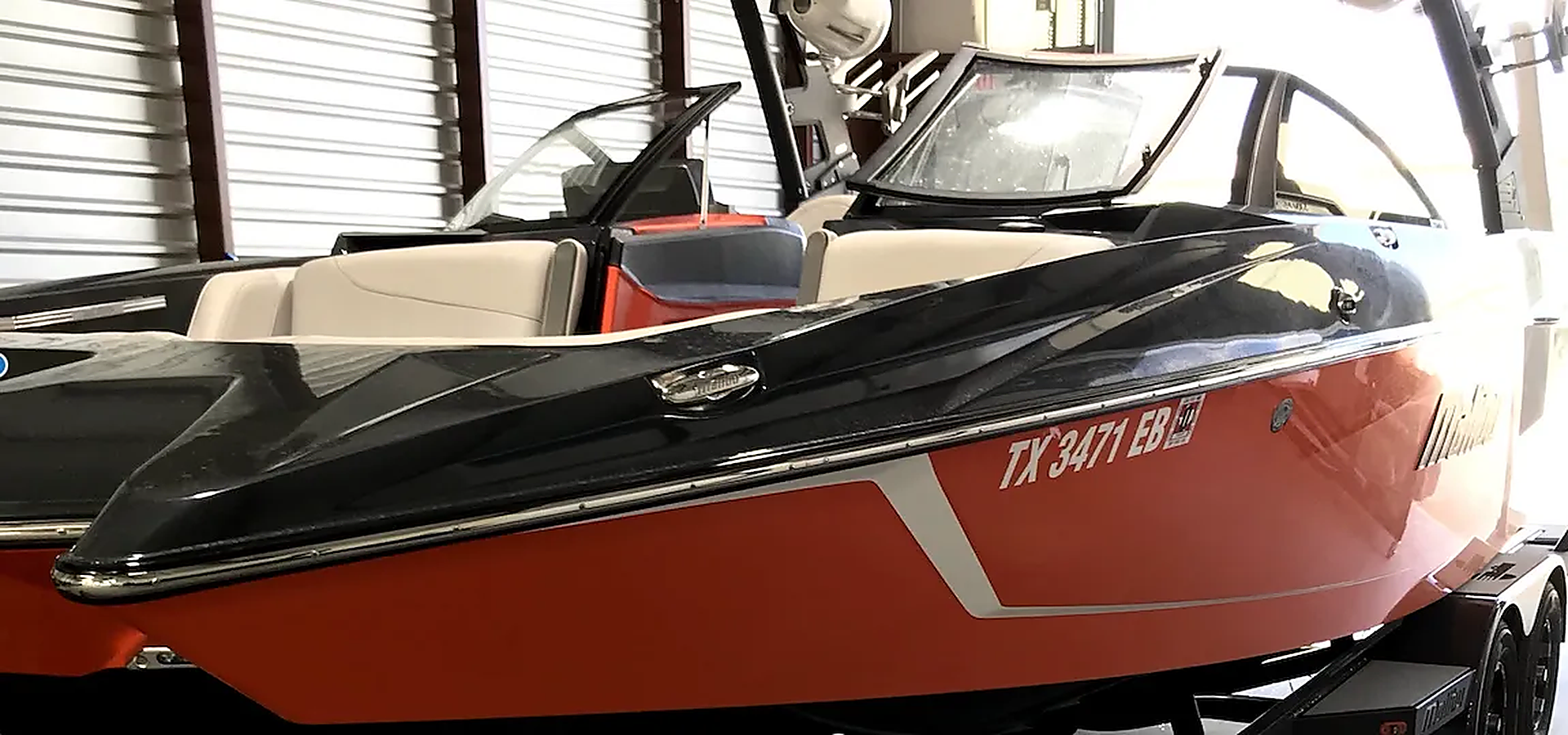 A black sports car is parked on the side of the road