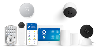 A security system is sitting on a table next to a cell phone. A security system is sitting on a table next to a cell phone.