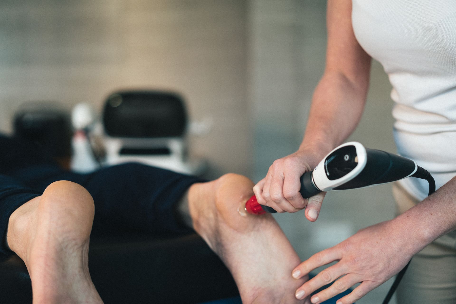 Podiatrist applying medicinal droplet to a foot — Dynamic Stride Podiatry in Nelson Baym, NSW