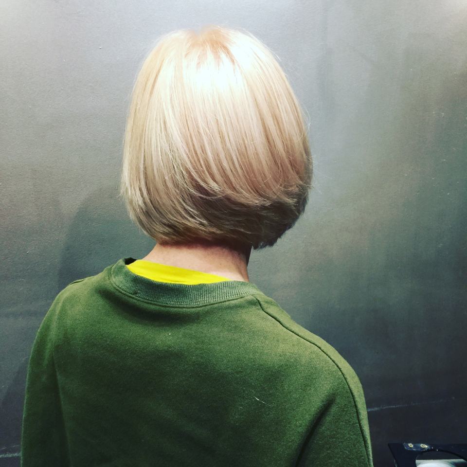 woman showing her short hair style