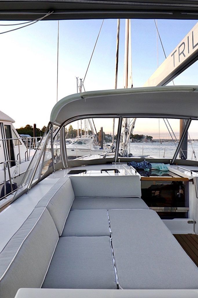 a red mustang convertible is parked in a garage .