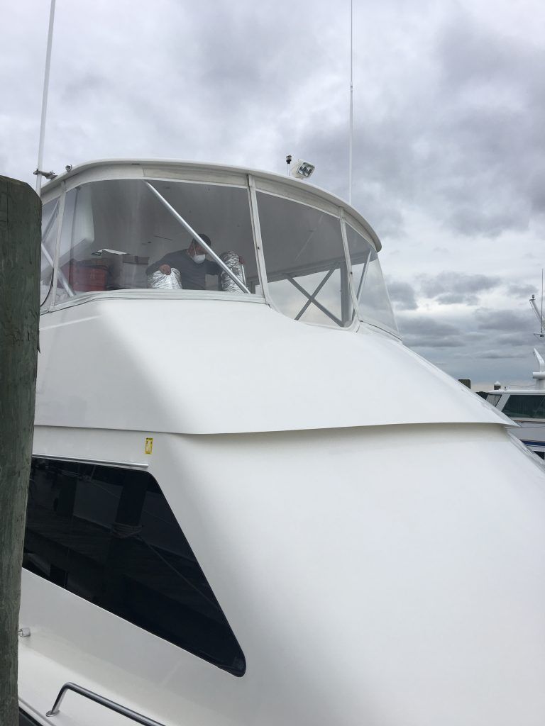 A white boat with the number 0 on the side