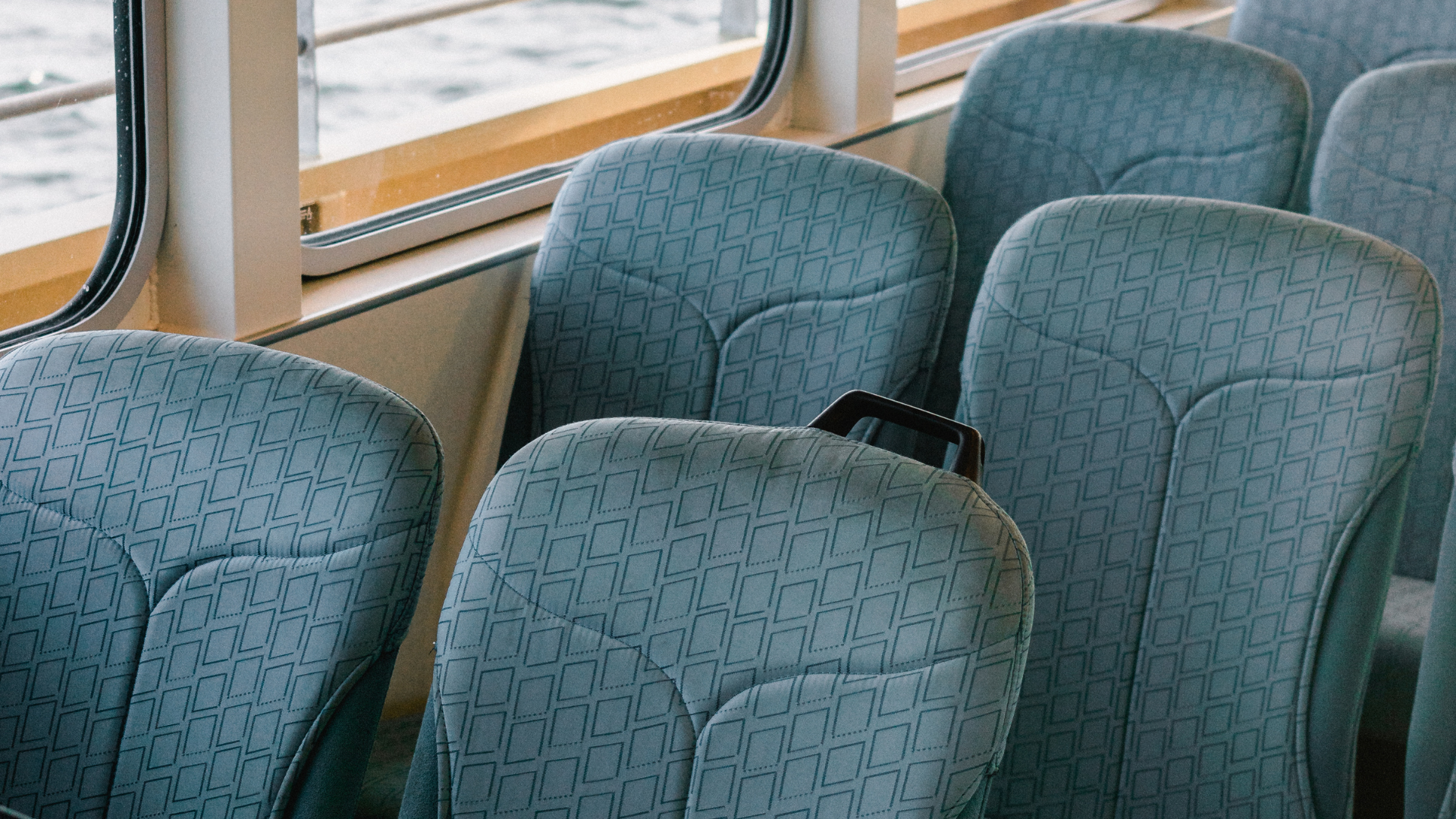 a green leather chaise lounge is sitting on the floor