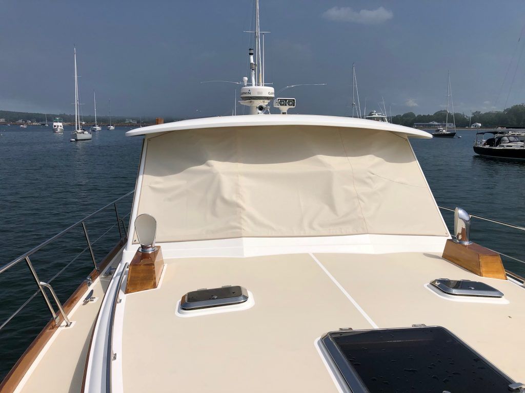 A boat is floating on top of a body of water.