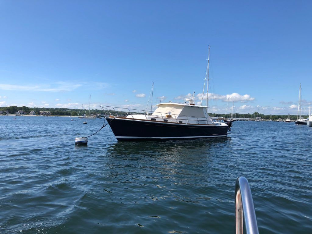 A boat is floating on top of a body of water.