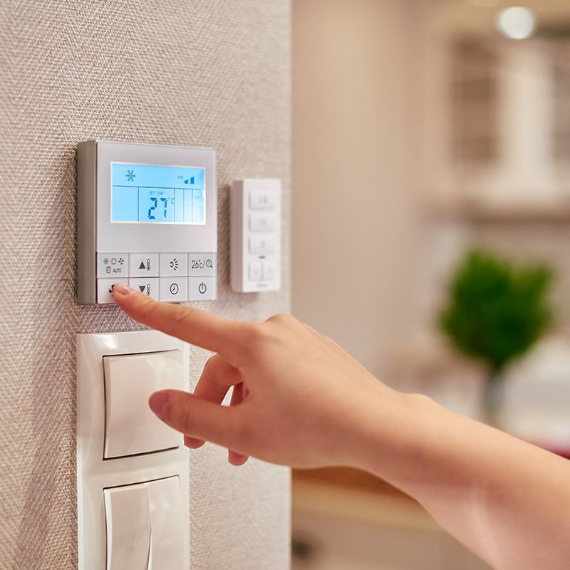 Person Using Thermostat