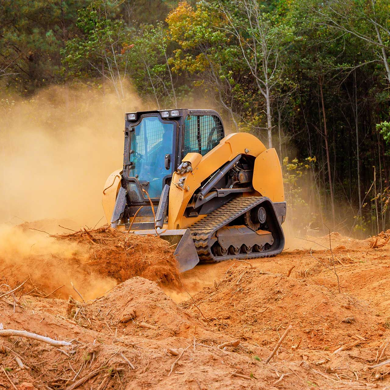 Powerful bulldozer clears soil