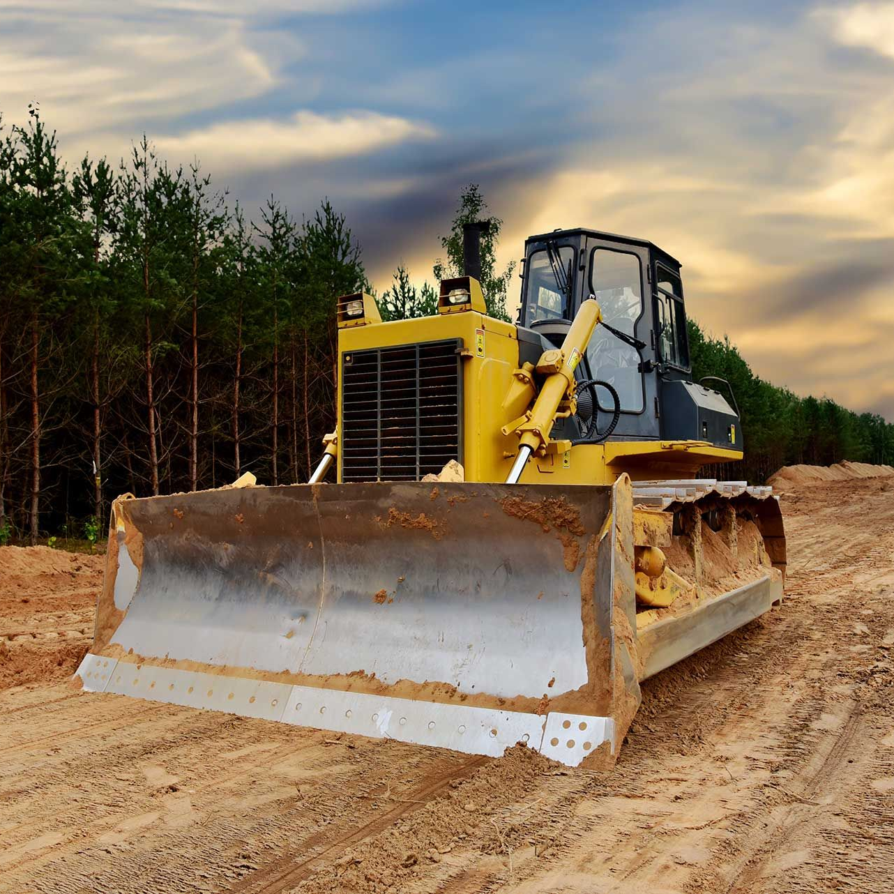 Dozer during clearing forest for construction new road