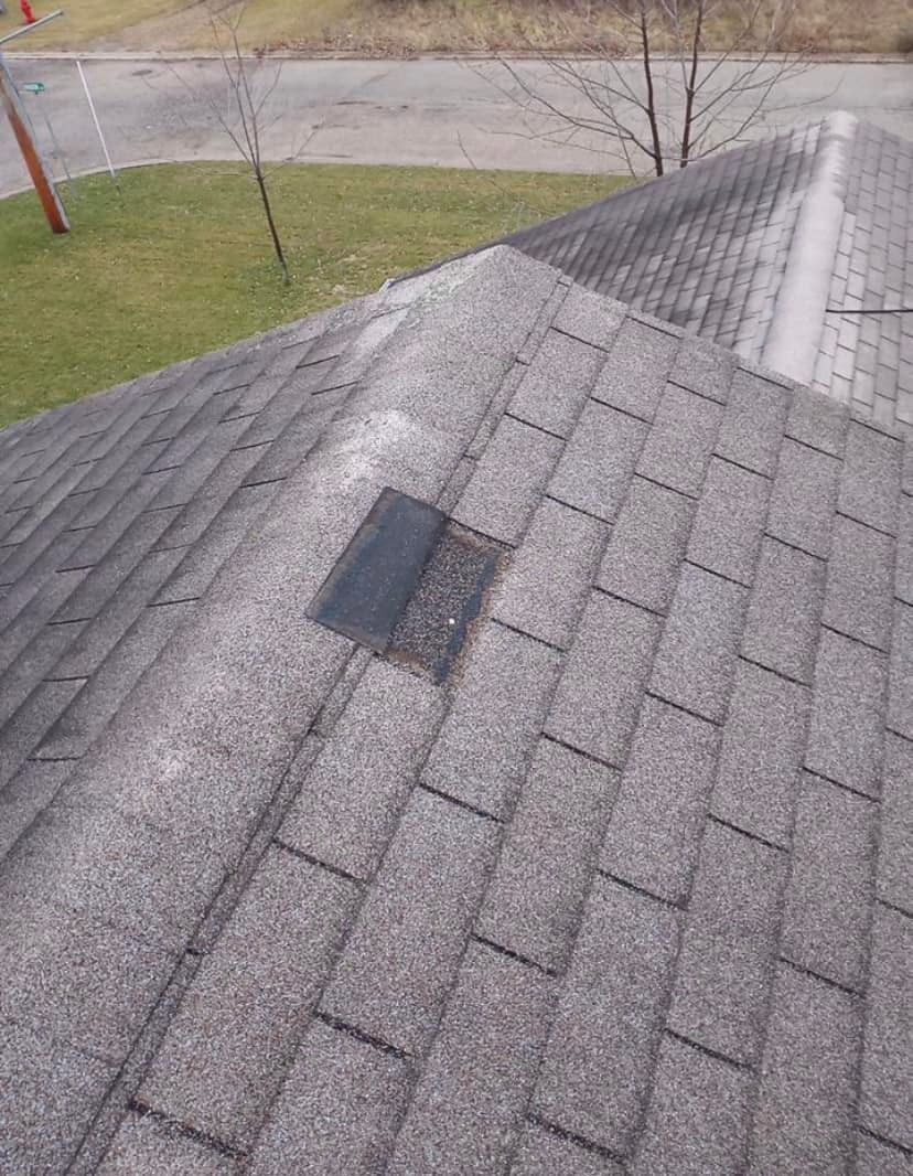 A close up of a roof with a hole in it.