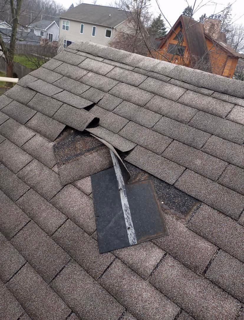A close up of a roof with a hole in it.