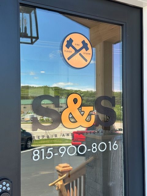 A door with a sticker on it that says s & s