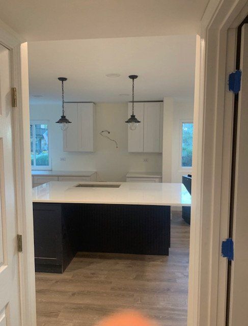 A kitchen with a large island in the middle of it