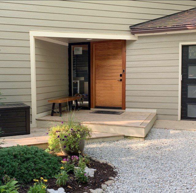 The front of a house with a wooden door