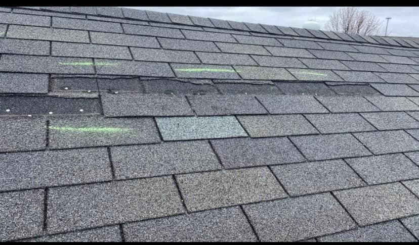 A close up of a roof with a lot of shingles on it.