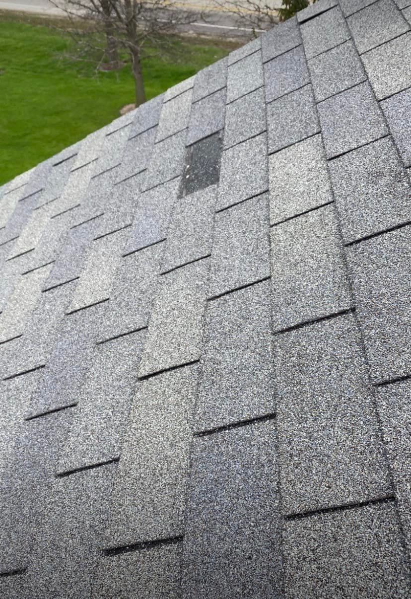 A close up of a roof with shingles on it.