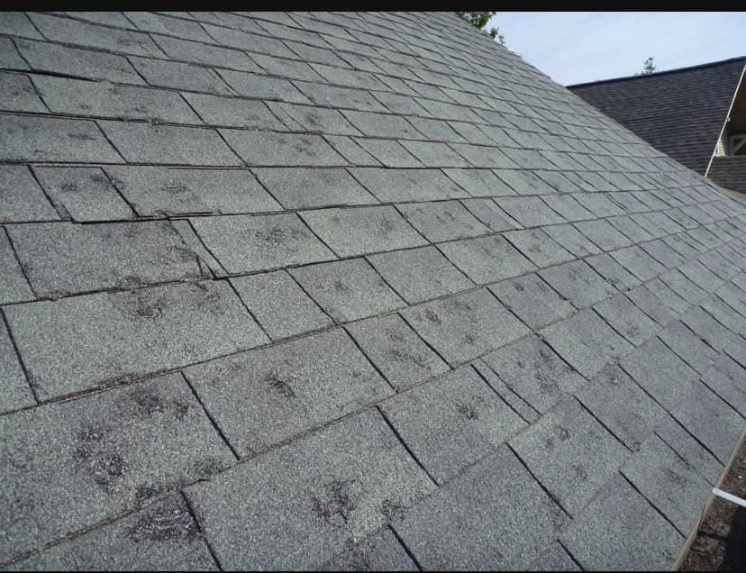 A close up of a roof with a lot of shingles
