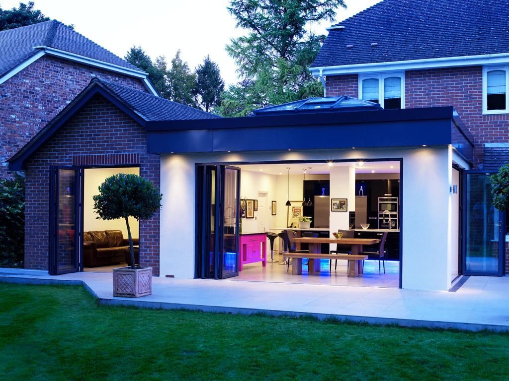 A brick house with a large sliding glass door