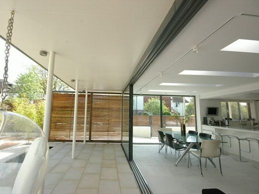 A dining room with a table and chairs in it