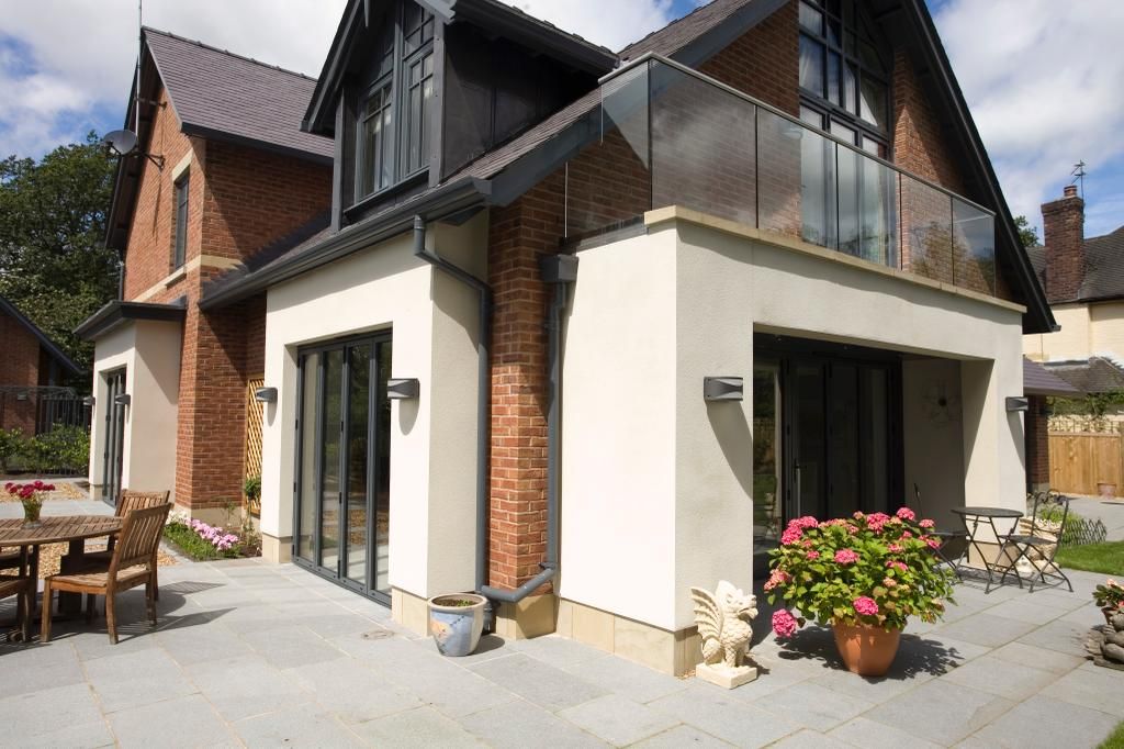 A large house with a balcony and a patio area