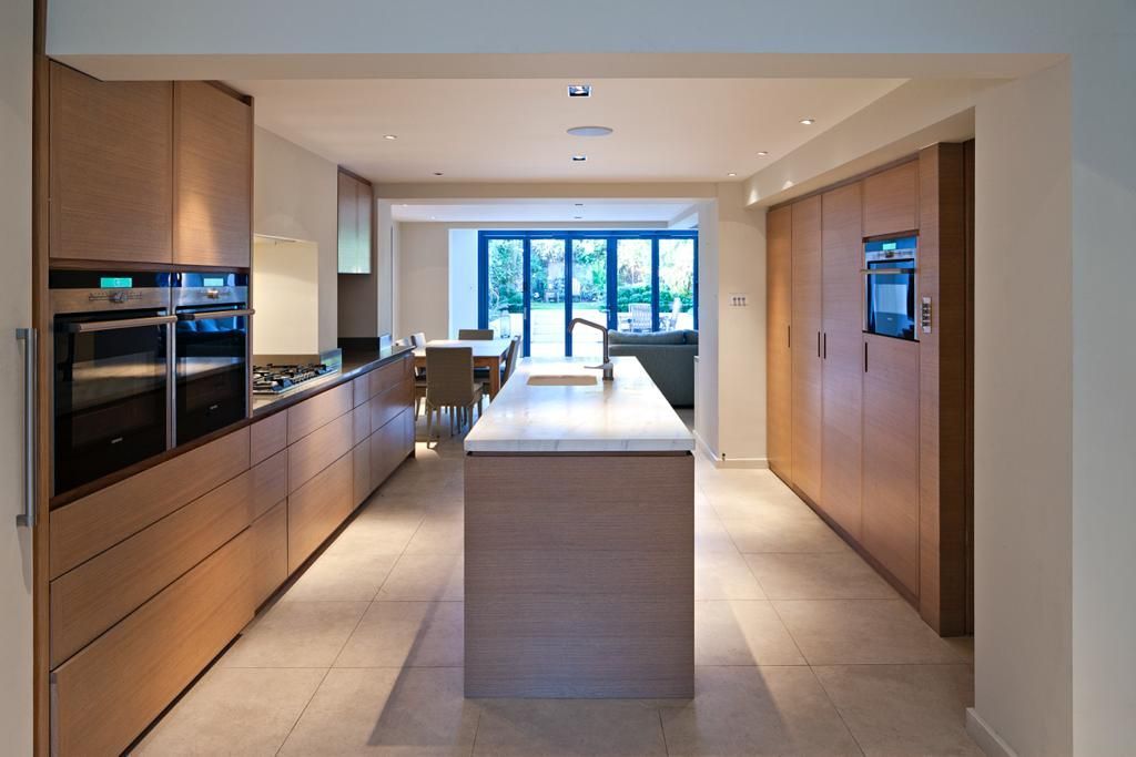 A kitchen with a large island in the middle