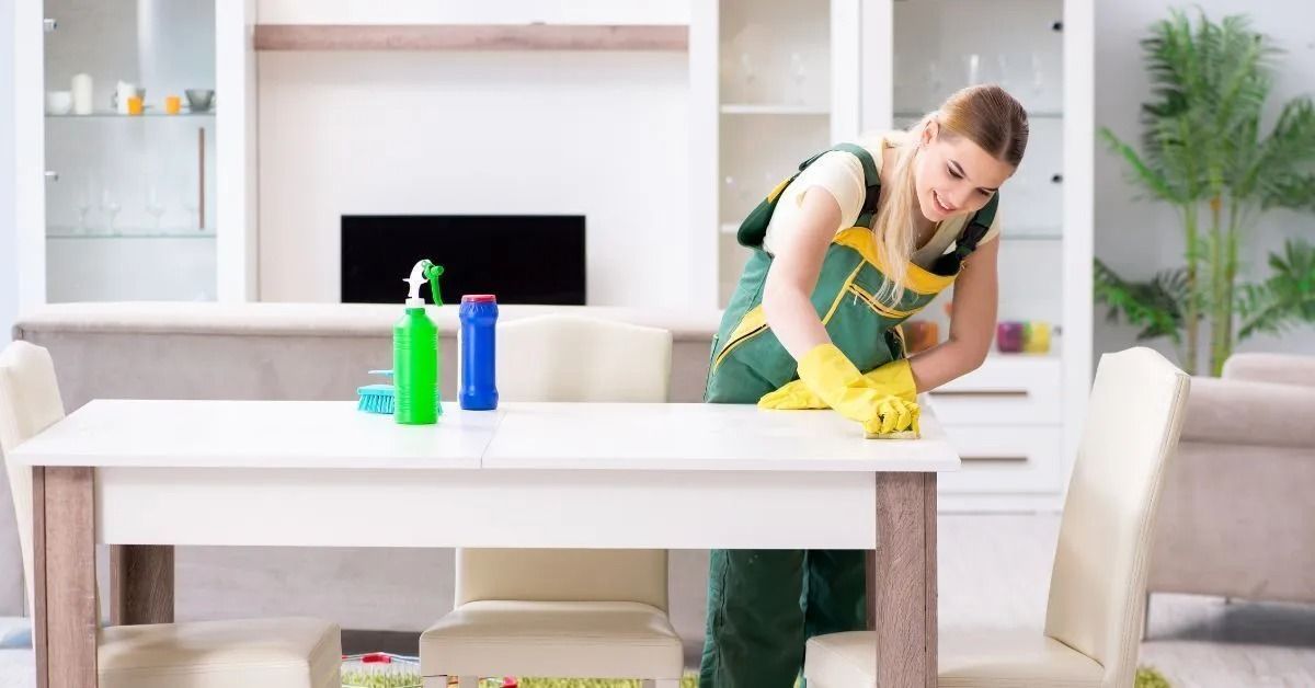 Woman Cleaning Table