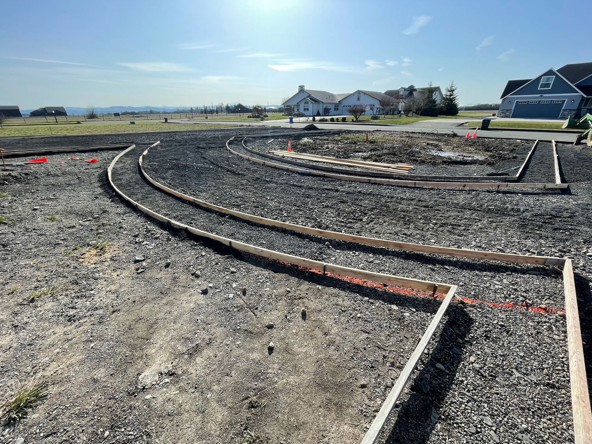 A labyrinth is being built in the middle of a gravel road.
