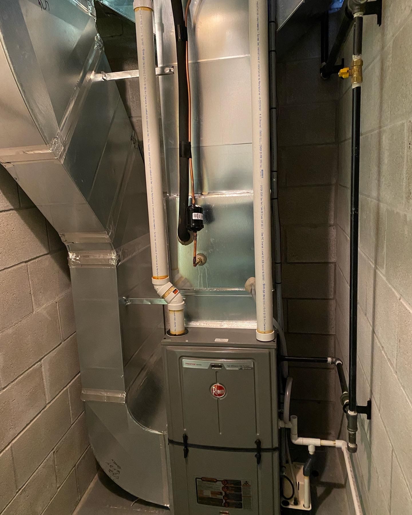 A picture of a furnace in a basement.