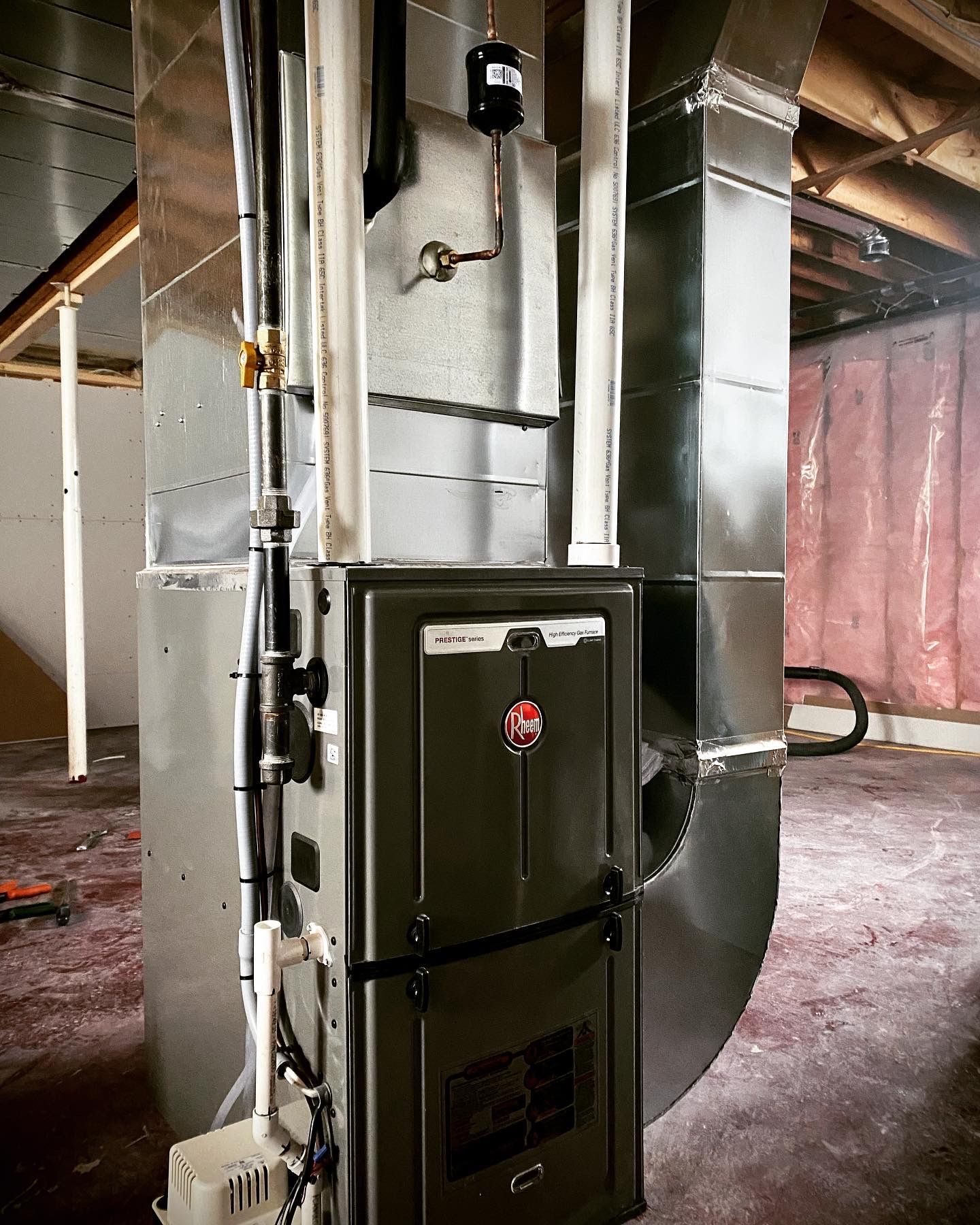 A heating and cooling system is installed in a basement.