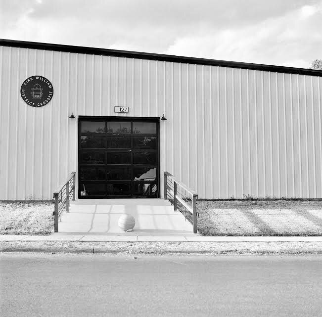 A black and white photo of the front of a building