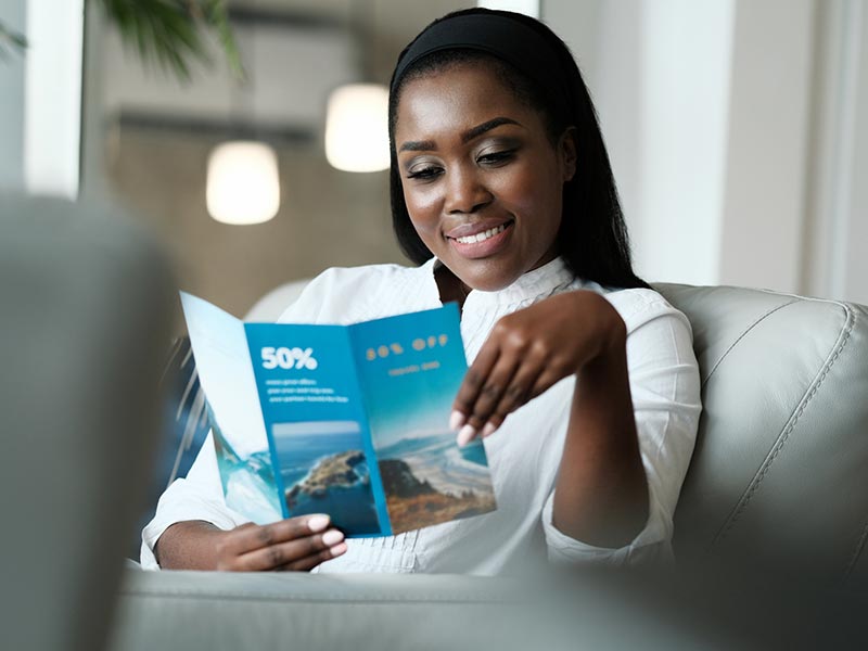 Woman Reading Brochure — Davie, FL — Fine Line Printing