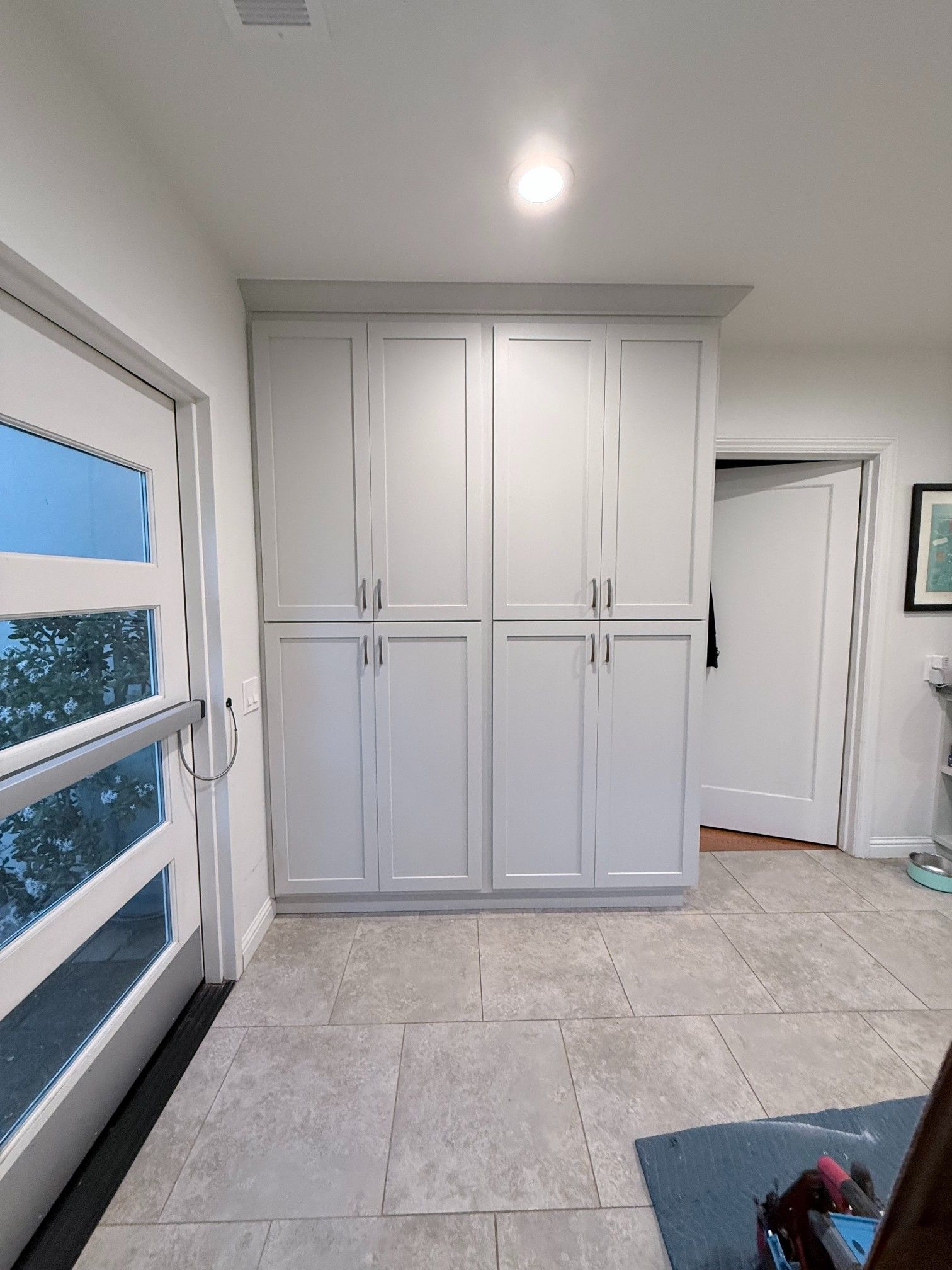 A kitchen with wooden cabinets and a white stove top oven
